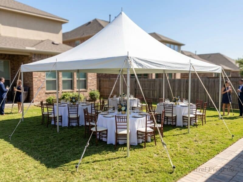 20x20 high peak pole tent rental in Fort Worth TX with fruitwood Chiavari chairs and round banquet tables for an outdoor event