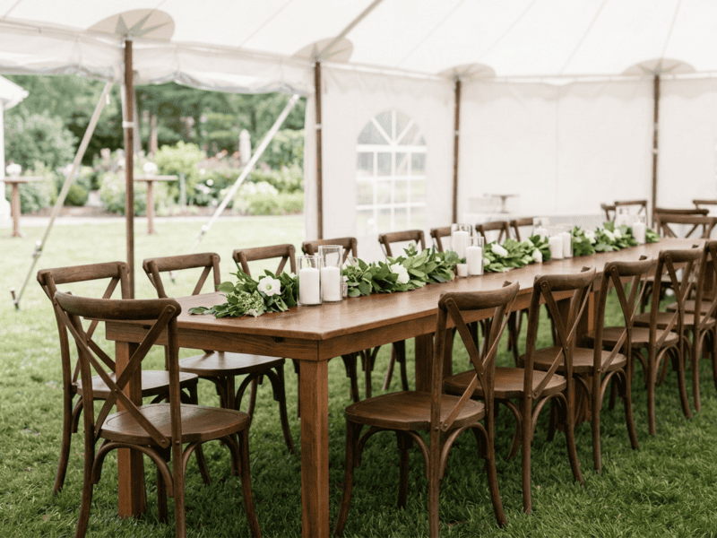 Fruitwood cross-back chair paired with farm table in Glen Rose TX — Boot & Barrel Event Co. rental