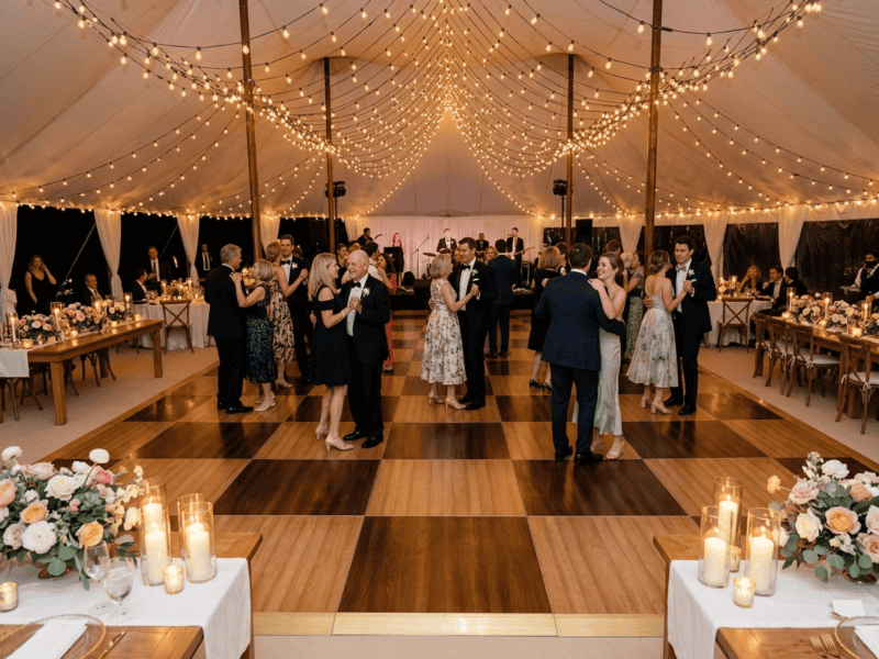 Chestnut fruitwood dance floor rental at an elegant outdoor birthday party with guests in cocktail attire and string lights — Boot & Barrel Event Co. Fort Worth TX