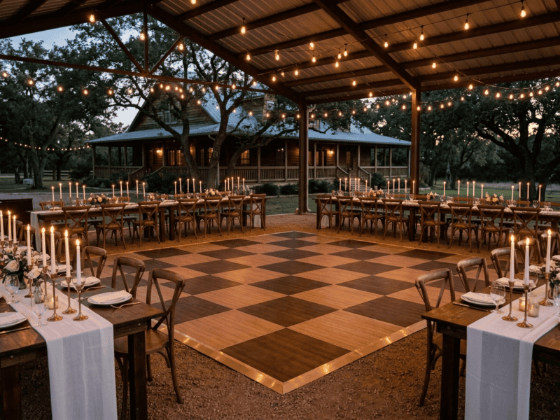 Chestnut and fruitwood dance floor rental at an elegant outdoor rehearsal dinner with taper candle centerpieces and string lights — Boot & Barrel Event Co. Midlothian TX