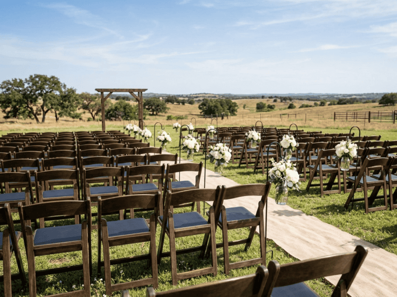 Fruitwood folding chair at ceremony seating in Grandview Texas — Boot & Barrel Event Co. rental