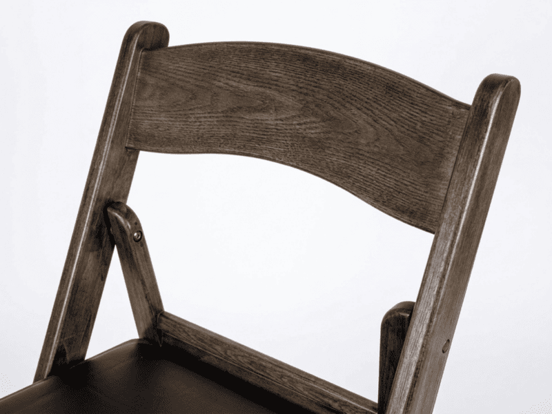 Fruitwood folding chair detail shot in Texas — Boot & Barrel Event Co. rental