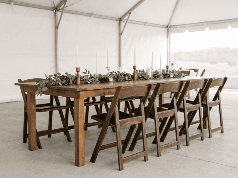 Fruitwood folding chair paired with farm table in Weatherford TX — Boot & Barrel Event Co. rental