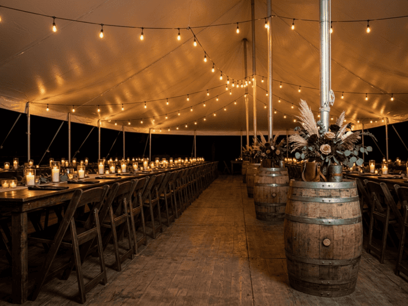 Fruitwood folding chair at night reception under tent in Grandview TX — Boot & Barrel Event Co. rental