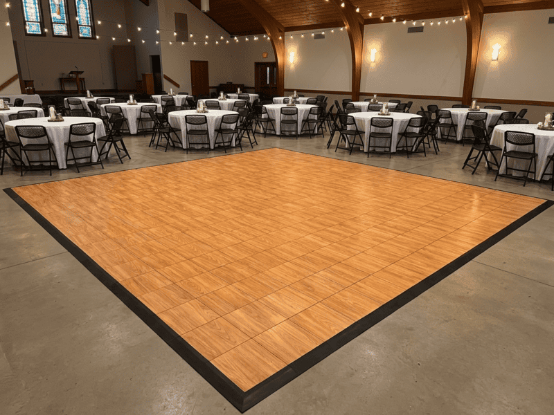 English chestnut indoor portable dance floor rental in a church fellowship hall event setup — Boot & Barrel Event Co. Benbrook TX