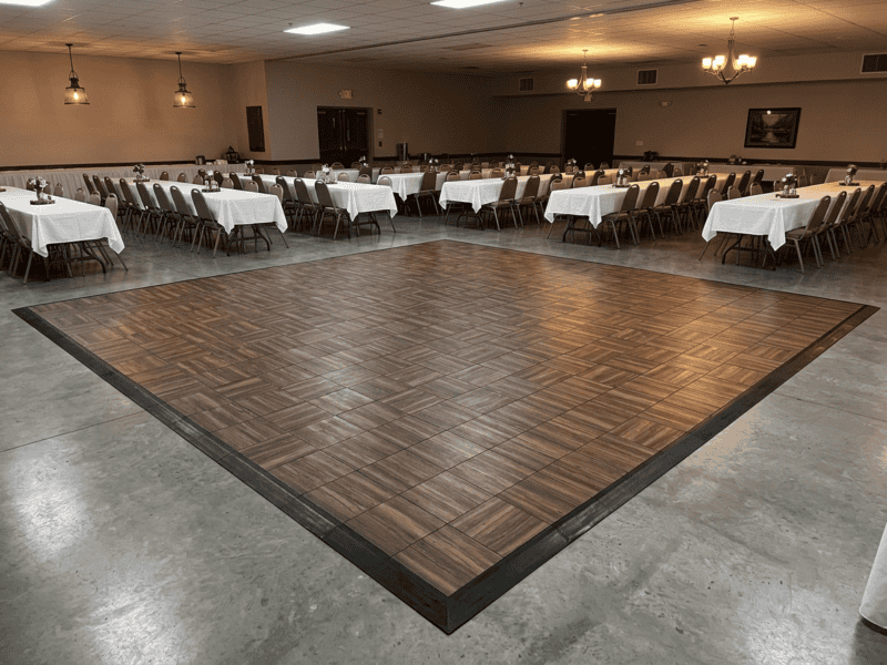 Espresso oak indoor portable dance floor rental empty setup in a church fellowship hall — Boot & Barrel Event Co. Burleson TX
