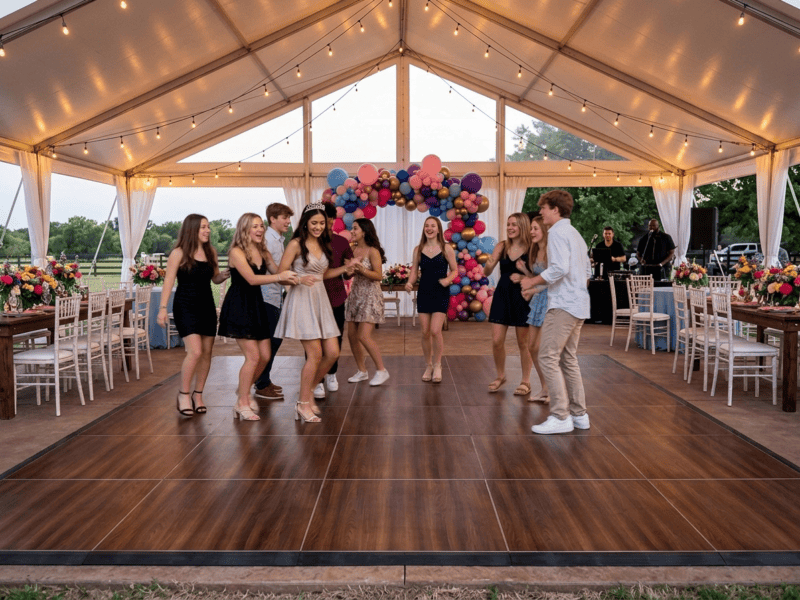 Fruitwood portable dance floor rental at an outdoor sweet sixteen party with balloon arch and string lights under white tent — Boot & Barrel Event Co. Crowley TX